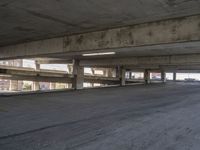 an empty parking space is shown in the daylight light from a sky scraper in this photo