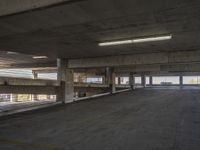 an empty parking space is shown in the daylight light from a sky scraper in this photo