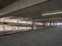 an empty parking space is shown in the daylight light from a sky scraper in this photo