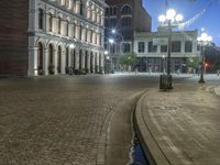 Urban Plaza with Cobblestone Streets and Street Lights