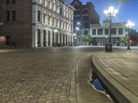 Urban Plaza with Cobblestone Streets and Street Lights