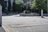 a person sitting at the bench in front of a mall that is empty of people