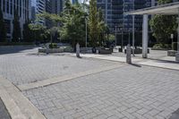 a person sitting at the bench in front of a mall that is empty of people