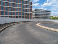 a car is driving on the highway through an underground parking garage area in a city