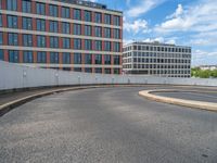 a car is driving on the highway through an underground parking garage area in a city