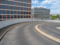 a car is driving on the highway through an underground parking garage area in a city