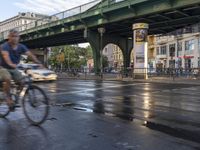 the view under the highway, on a rainy day of the city street and on the streets with buildings and bicycles