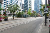 the empty road is very crowded with people walking on it, but many have been stopped