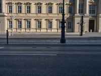 two lanes that appear to be in the middle of the road, and are straight lines to the left