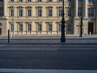 two lanes that appear to be in the middle of the road, and are straight lines to the left