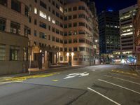 the city street is empty during the night time hours of construction work and business district