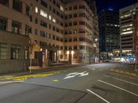 the city street is empty during the night time hours of construction work and business district