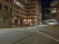 the city street is empty during the night time hours of construction work and business district