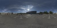 the view of an empty parking lot from a fisheye lens with white markings on it