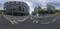 a street intersection with three buildings and a double view lens effect in the foreground