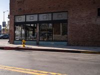 Urban Scene in Los Angeles with Hydrant and Brick Wall