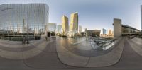 a large circular panorama shows skyscrapers and other buildings in a modern city with a ramp