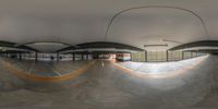 the view from inside an indoor skate park in motion and showing a ramp where it appears