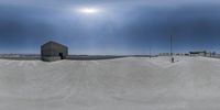 a 360 - degree photograph of a skateboarder at the skate park near the parking lots