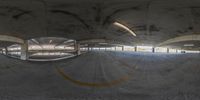 a 360 view of an empty skateboard park filled with lots of vehicles and people