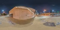 a city skyline is shown with a reflection in a fish - eye lens image as the skateboarders practice