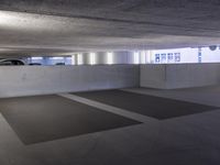 a person is skateboarding in an empty parking garage for people to use his board