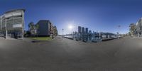 three pictures, taken from a fish eye view, depicting urban buildings and water with sunlight