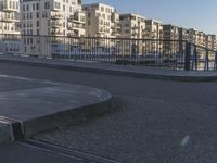 an area where people have their skateboards parked on the curb in front of them
