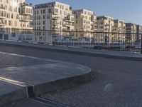 an area where people have their skateboards parked on the curb in front of them