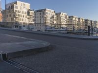 an area where people have their skateboards parked on the curb in front of them