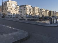an area where people have their skateboards parked on the curb in front of them