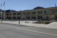 a yellow line is on a road in front of an old building with buildings on both sides