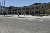 a yellow line is on a road in front of an old building with buildings on both sides