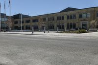 a yellow line is on a road in front of an old building with buildings on both sides