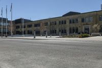 a yellow line is on a road in front of an old building with buildings on both sides