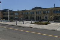 a yellow line is on a road in front of an old building with buildings on both sides