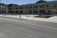 a yellow line is on a road in front of an old building with buildings on both sides