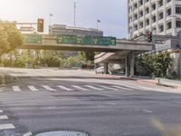 a car is driving on the road while traffic lights go by and exit the city