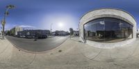 a picture of an outside city street taken in the day time with a fish eye lens