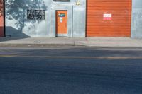 an image of a door, on the side of the building near the fire hydrant and in the foreground it is a mural of a woman with the sunliting