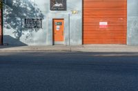 an image of a door, on the side of the building near the fire hydrant and in the foreground it is a mural of a woman with the sunliting