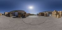 a photo of a panoramic view of a large warehouse full of boxes and crates