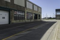 a sidewalk near a car wash station and a road with a red fire hydrant