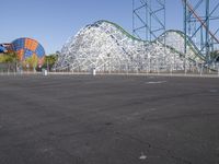 the amusement park has an elaborate roller coasterer theme on it's track and a roller coaster coaster