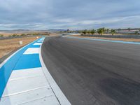 USA Asphalt Road: Curves and Cloudy Sky