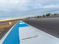 USA Asphalt Road: Curves and Cloudy Sky