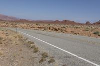 USA: Asphalt Road through the Desert Landscape