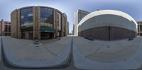 a street view looking up at several buildings around the circle, one of which is an oval