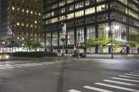 the view of a city with several tall buildings, street lights and people crossing a crosswalk