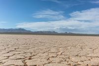 the sun is shining on dry ground in the middle of nowhere and no clouds in the sky